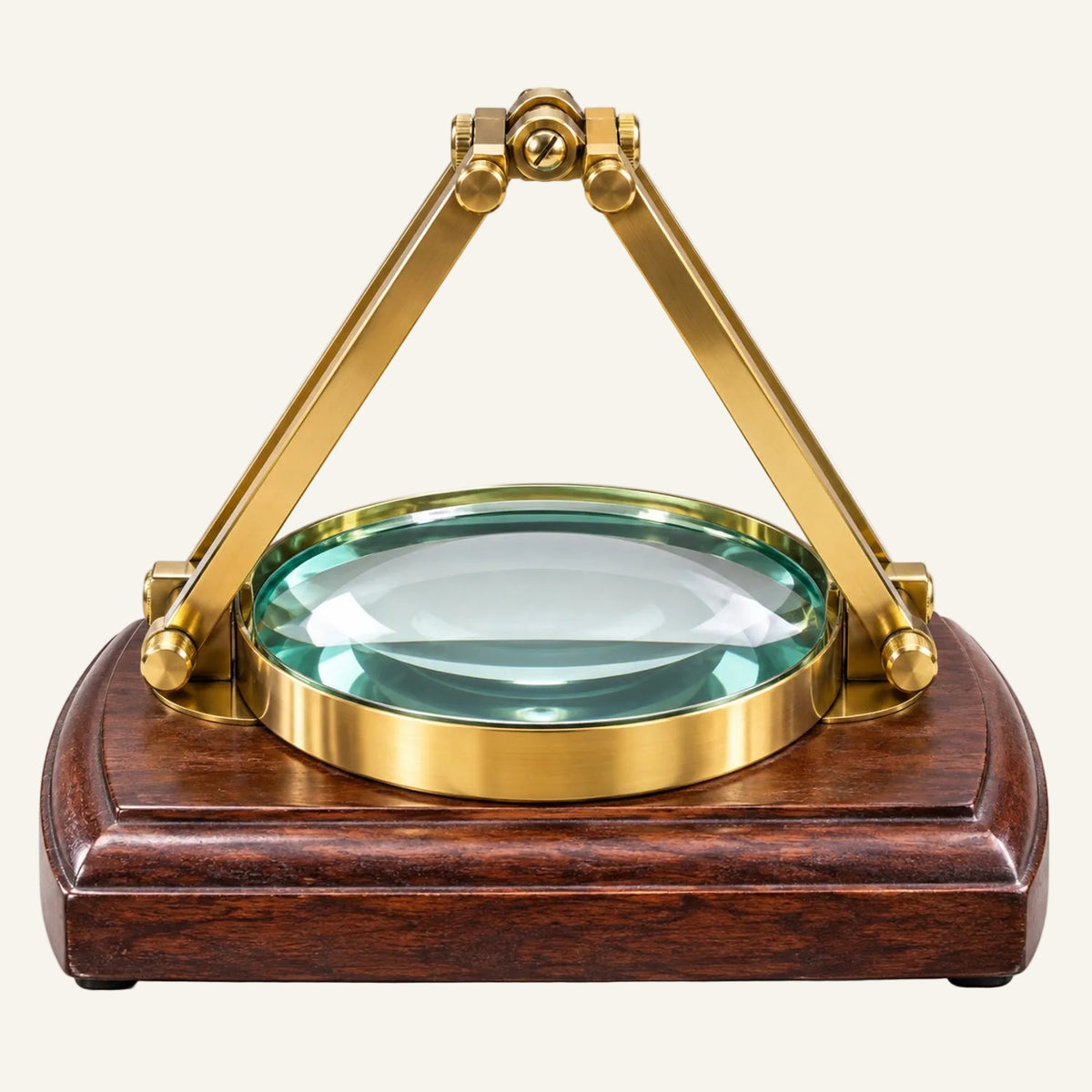 A magnifying glass with a polished brass tripod handle and a dark reddish-brown wooden base, shown on a clean white background.